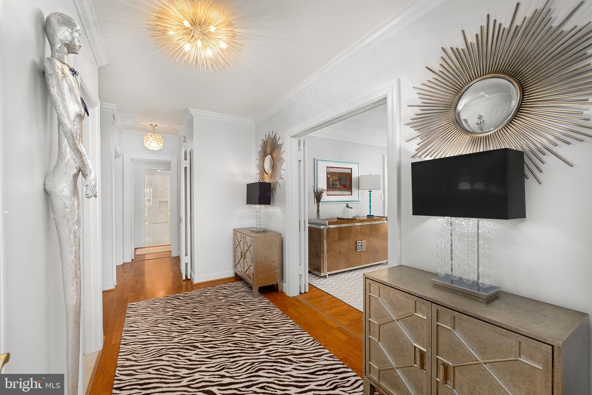 2801 New Mexico Avenue Northwest, Unit 204 Washington, DC 20007 - Photo 9 of 49 a living room with furniture and a flat screen tv