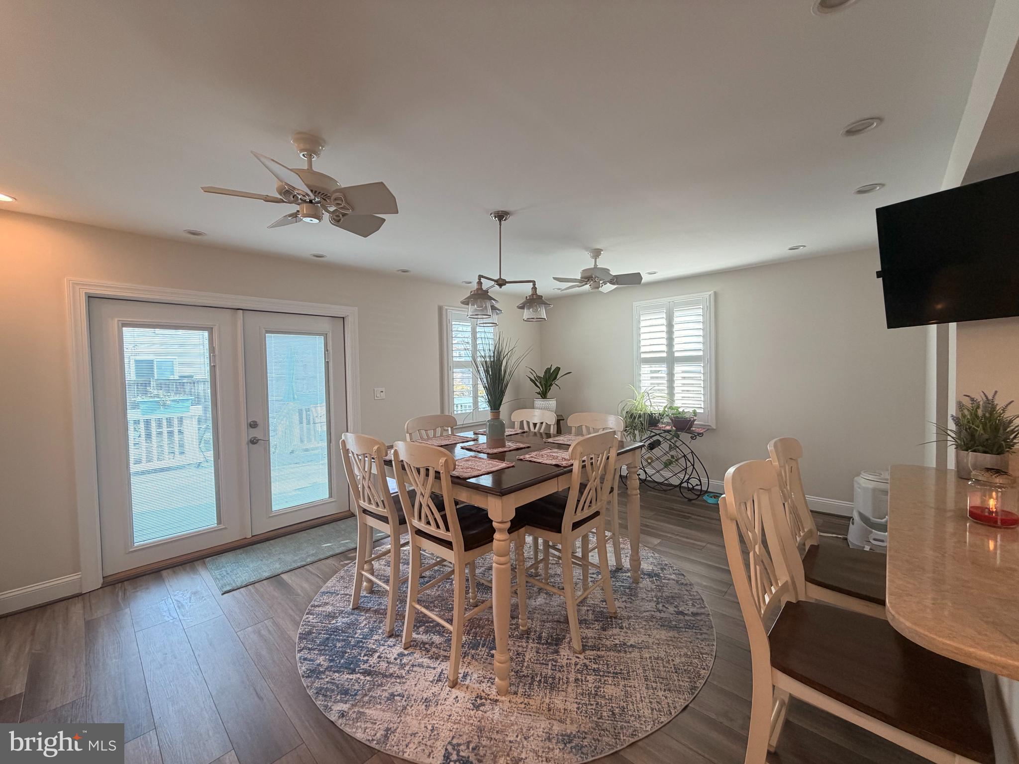 1705 Fairhill Drive Edgewater, MD 21037 - Photo 13 of 36 a view of a dining room with furniture window and wooden floor