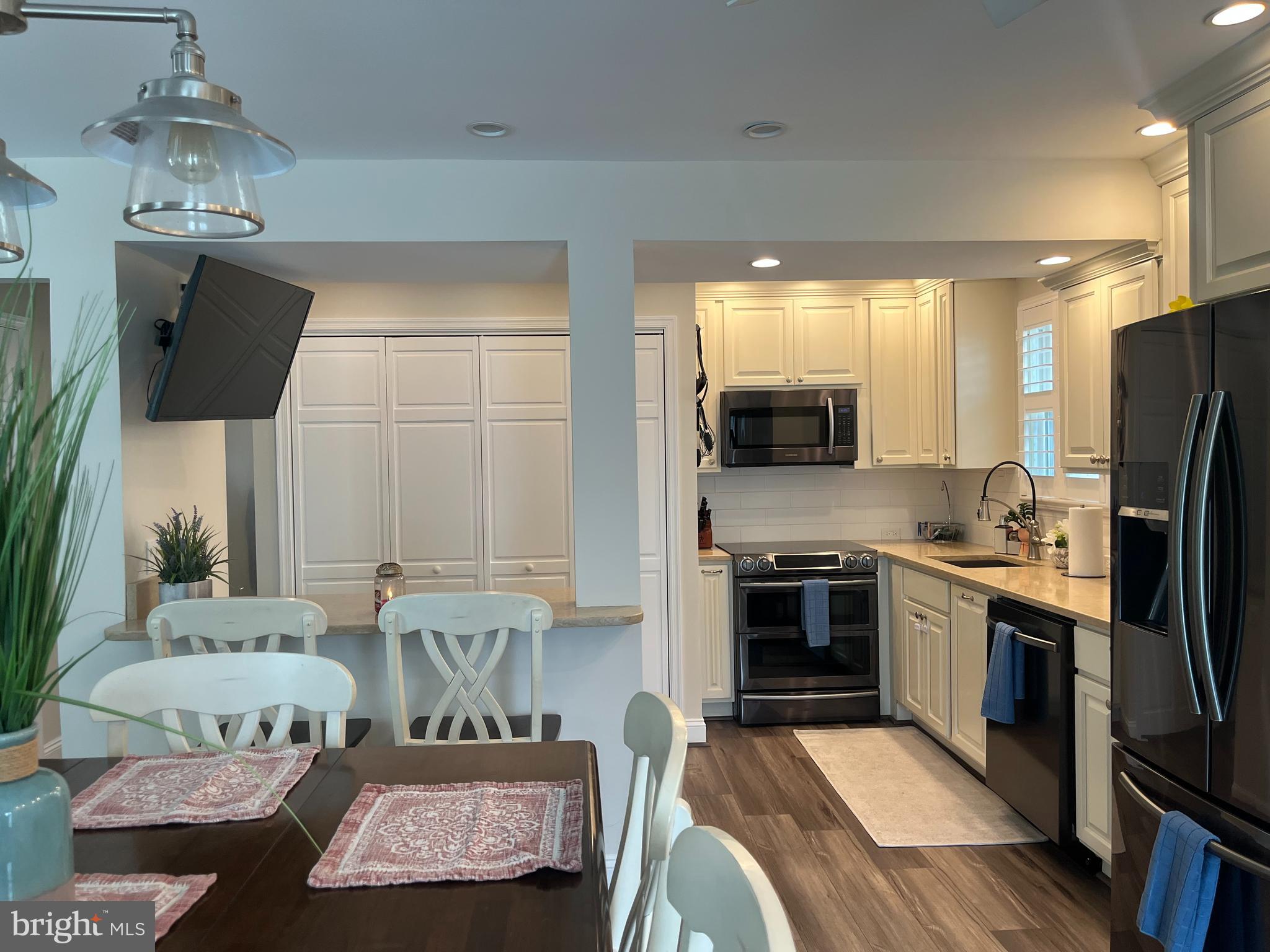 1705 Fairhill Drive Edgewater, MD 21037 - Photo 14 of 36 a kitchen with stainless steel appliances granite countertop a stove and a refrigerator