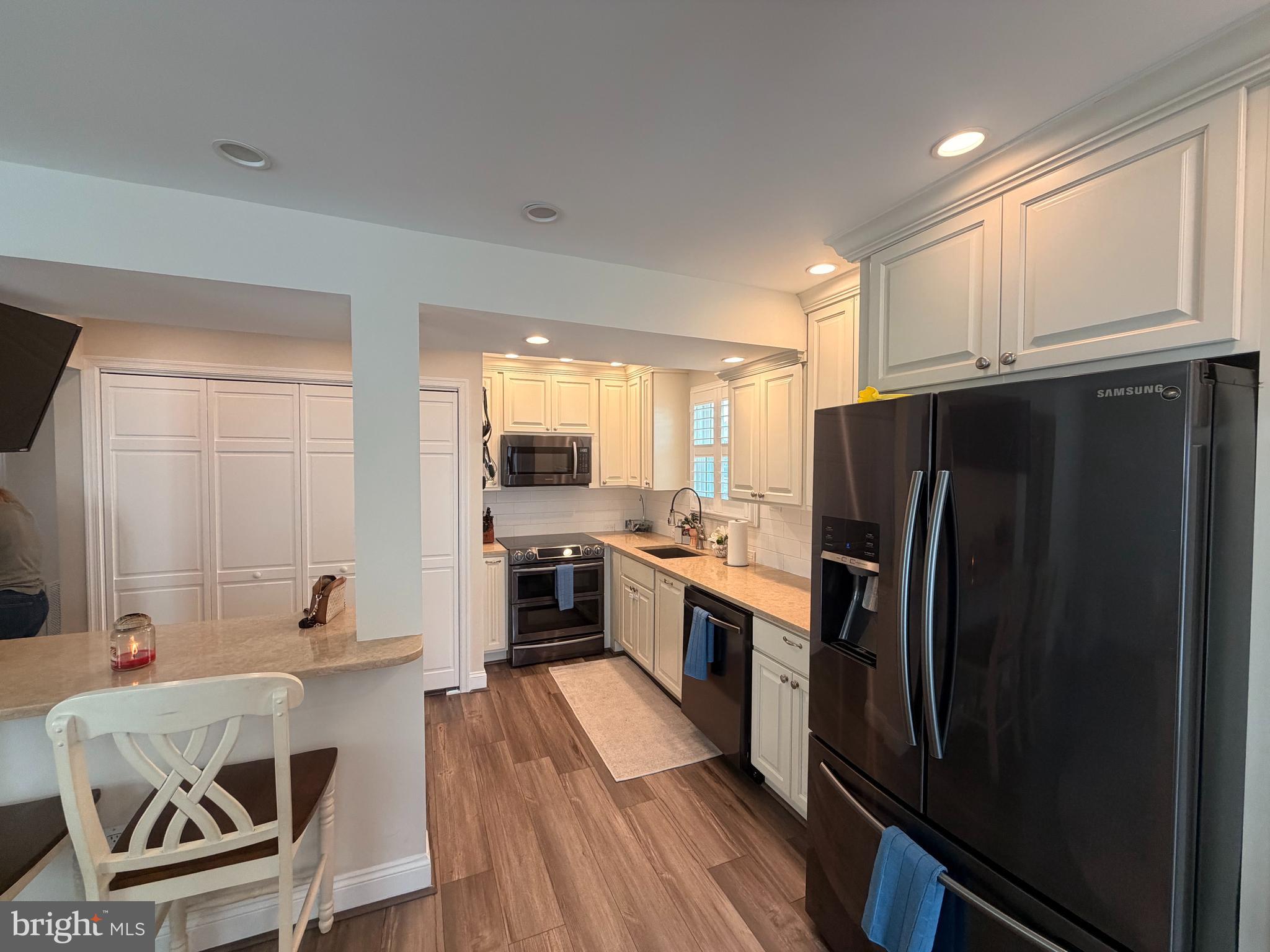 1705 Fairhill Drive Edgewater, MD 21037 - Photo 15 of 36 a kitchen with granite countertop a refrigerator stove and sink