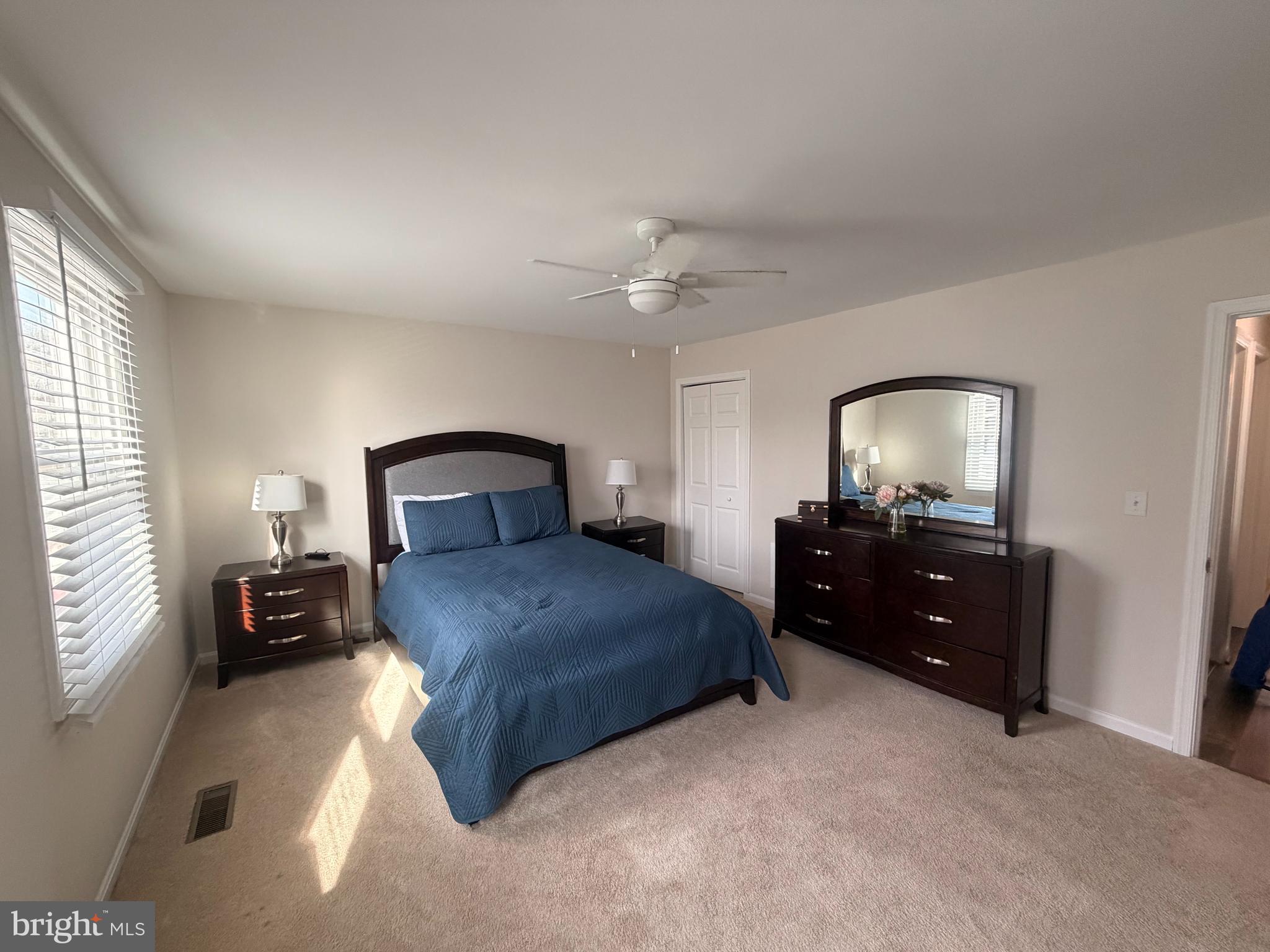 1705 Fairhill Drive Edgewater, MD 21037 - Photo 19 of 36 a bedroom with a bed and a chandelier