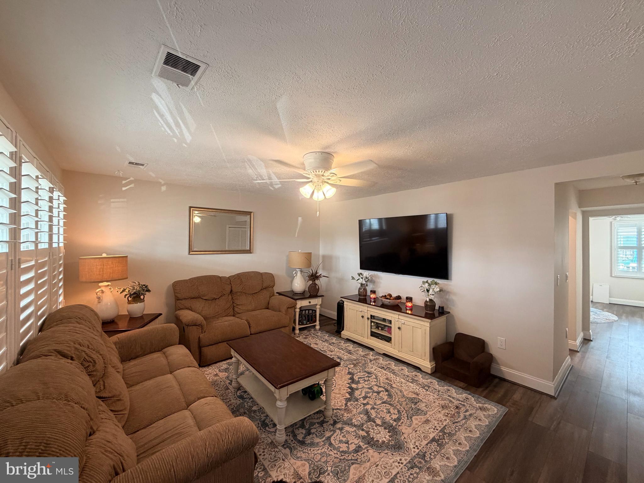 1705 Fairhill Drive Edgewater, MD 21037 - Photo 3 of 36 a living room with furniture and a flat screen tv