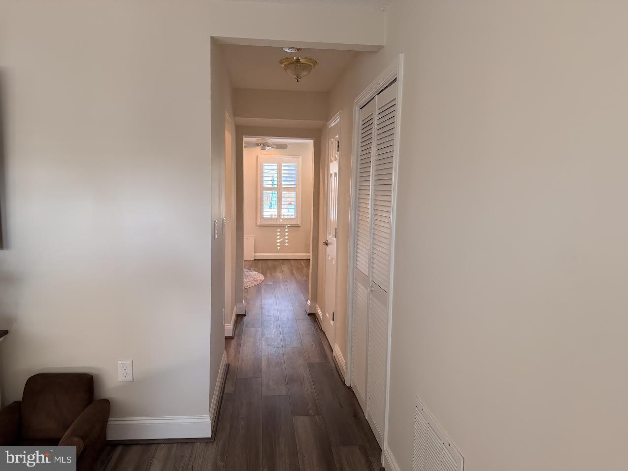 1705 Fairhill Drive Edgewater, MD 21037 - Photo 6 of 36 a view of a hallway with wooden floor and a bathroom
