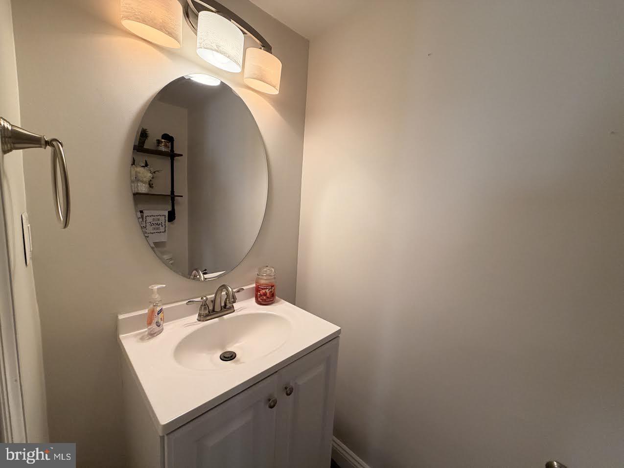 1705 Fairhill Drive Edgewater, MD 21037 - Photo 7 of 36 a bathroom with a sink mirror and vanity