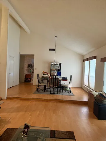 a view of a dining room with furniture and window
