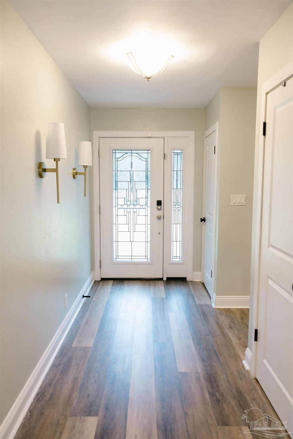 5580 Homewood Road Pensacola, FL 32504 - Photo 16 of 28 wooden floor in an empty room with a window