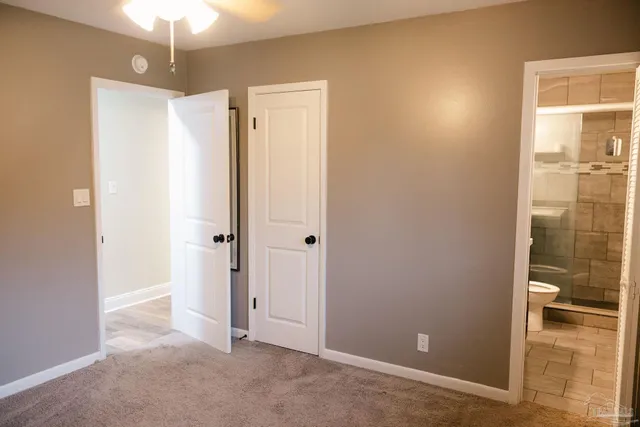 a bathroom with a shower and a toilet