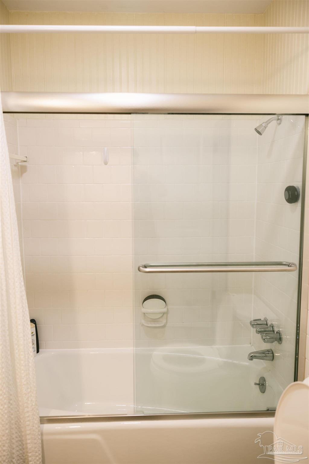 5580 Homewood Road Pensacola, FL 32504 - Photo 25 of 28 a bathroom with a shower and a bath tub