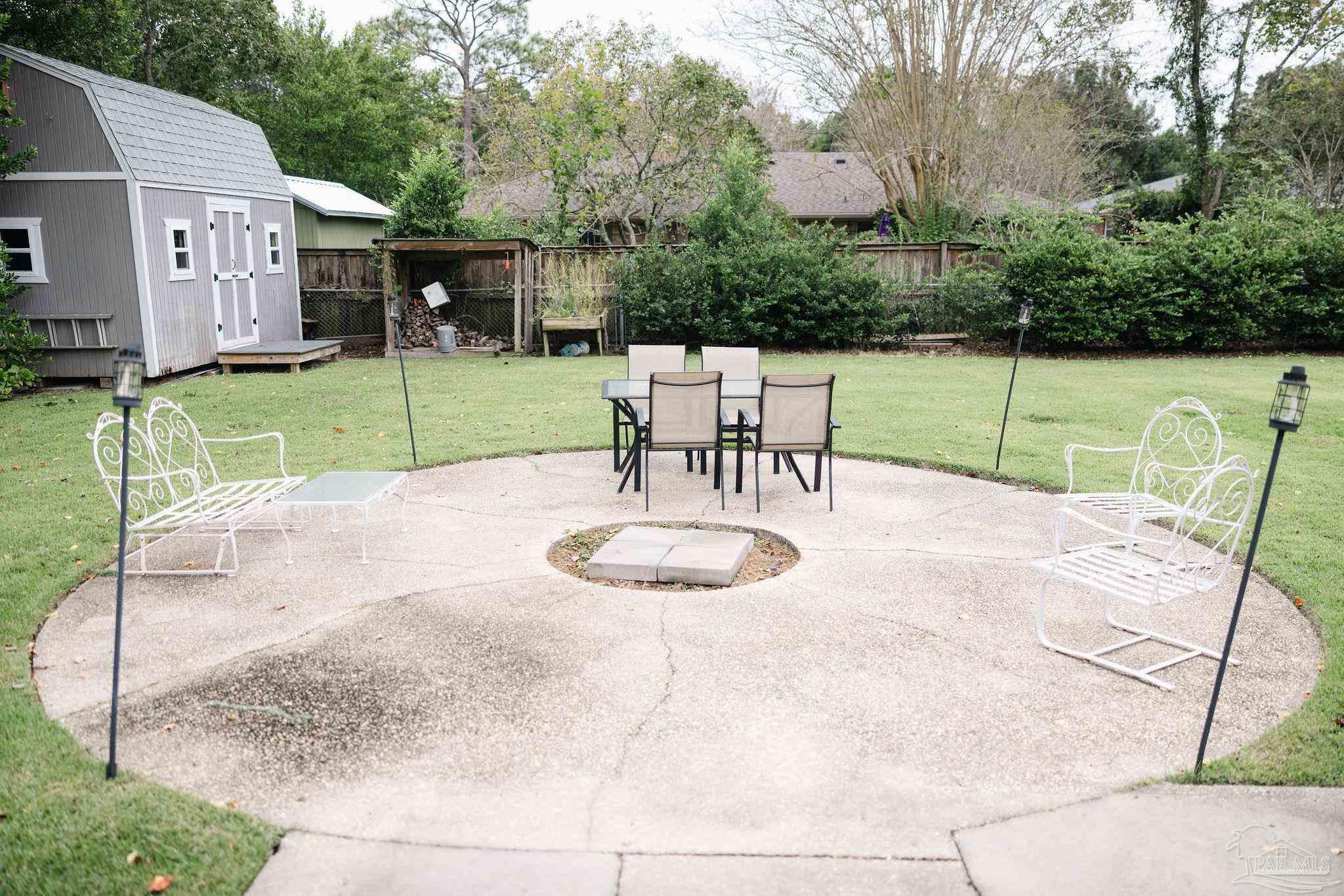 5580 Homewood Road Pensacola, FL 32504 - Photo 26 of 28 a view of a backyard with sitting area