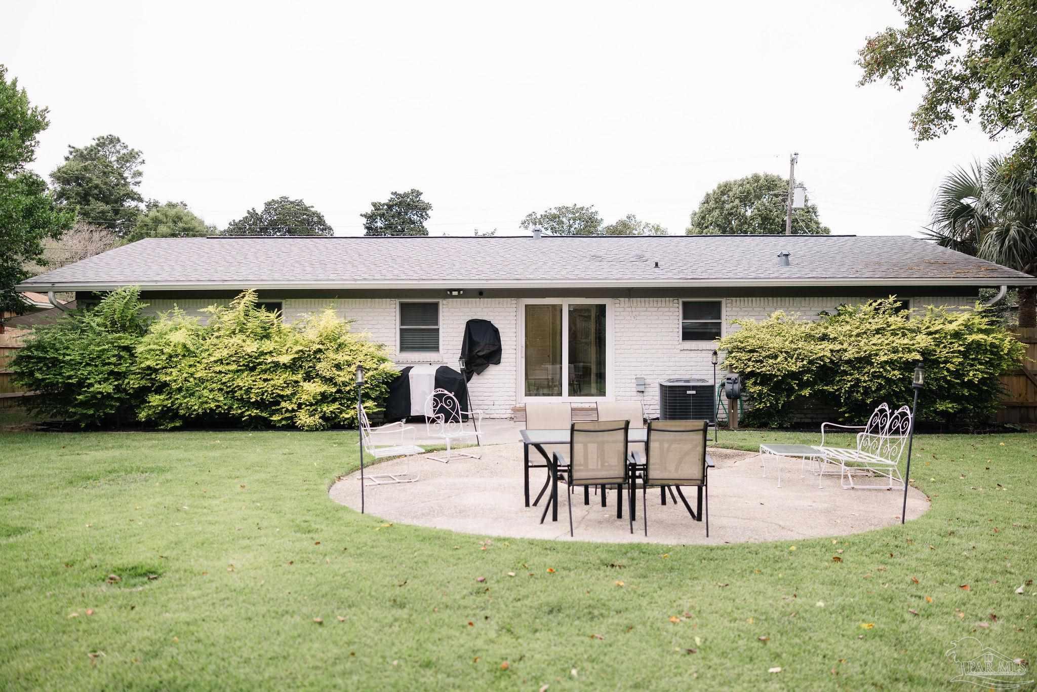 5580 Homewood Road Pensacola, FL 32504 - Photo 28 of 28 a view of a house with backyard and sitting area