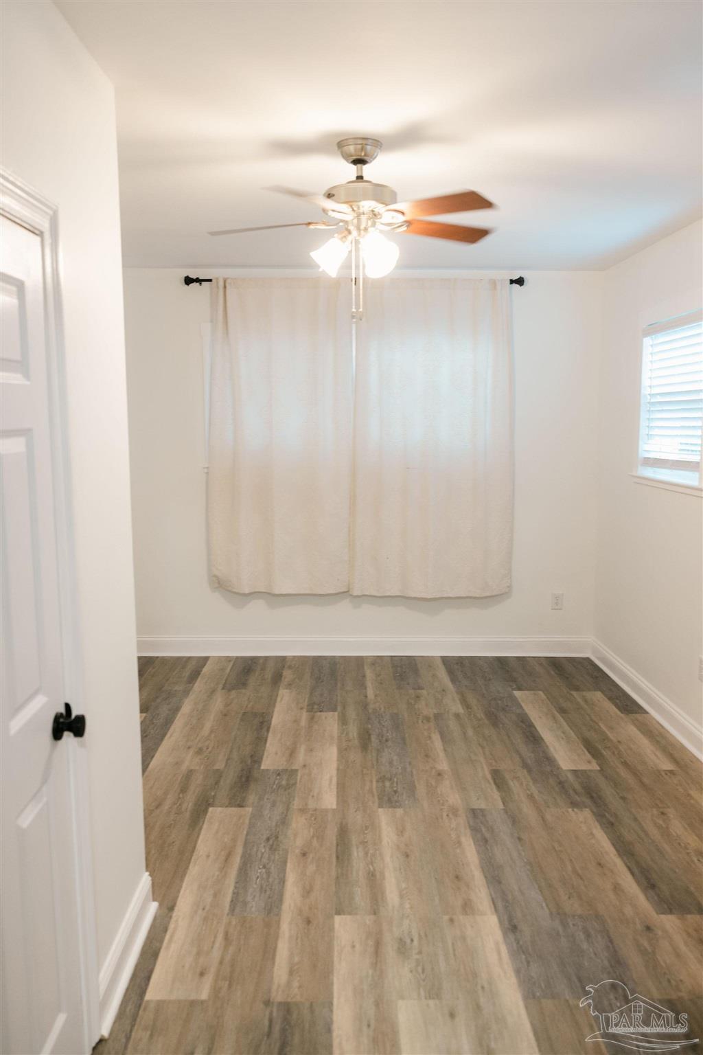 5580 Homewood Road Pensacola, FL 32504 - Photo 8 of 28 wooden floor in an empty room