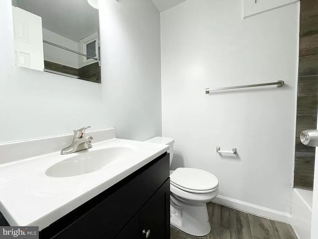 1240 Simms Place Northeast Washington, DC 20002 - Photo 6 of 8 a bathroom with a sink toilet and a mirror