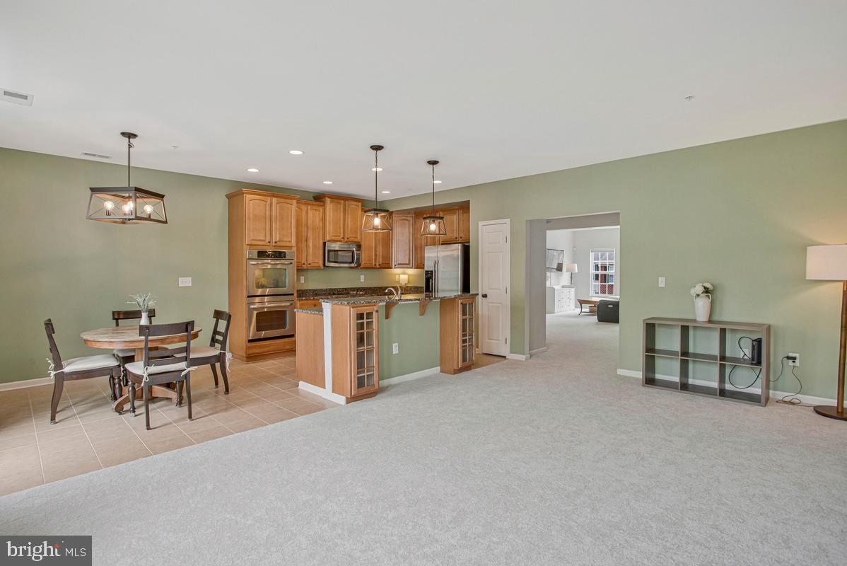 2310 Forest Ridge Terrace, Unit 6 Chesapeake Beach, MD 20732 - Photo 9 of 58 Open Family room and kitchen
