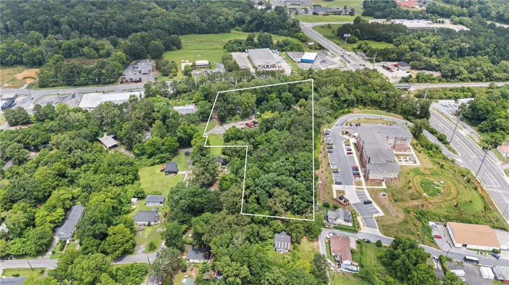 1202 Desoto Avenue Northwest Rome, GA 30165 - Photo 16 of 19 an aerial view of a house with a yard and lake view