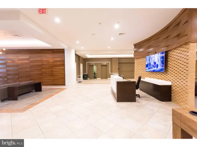 a lobby with a couch and a television