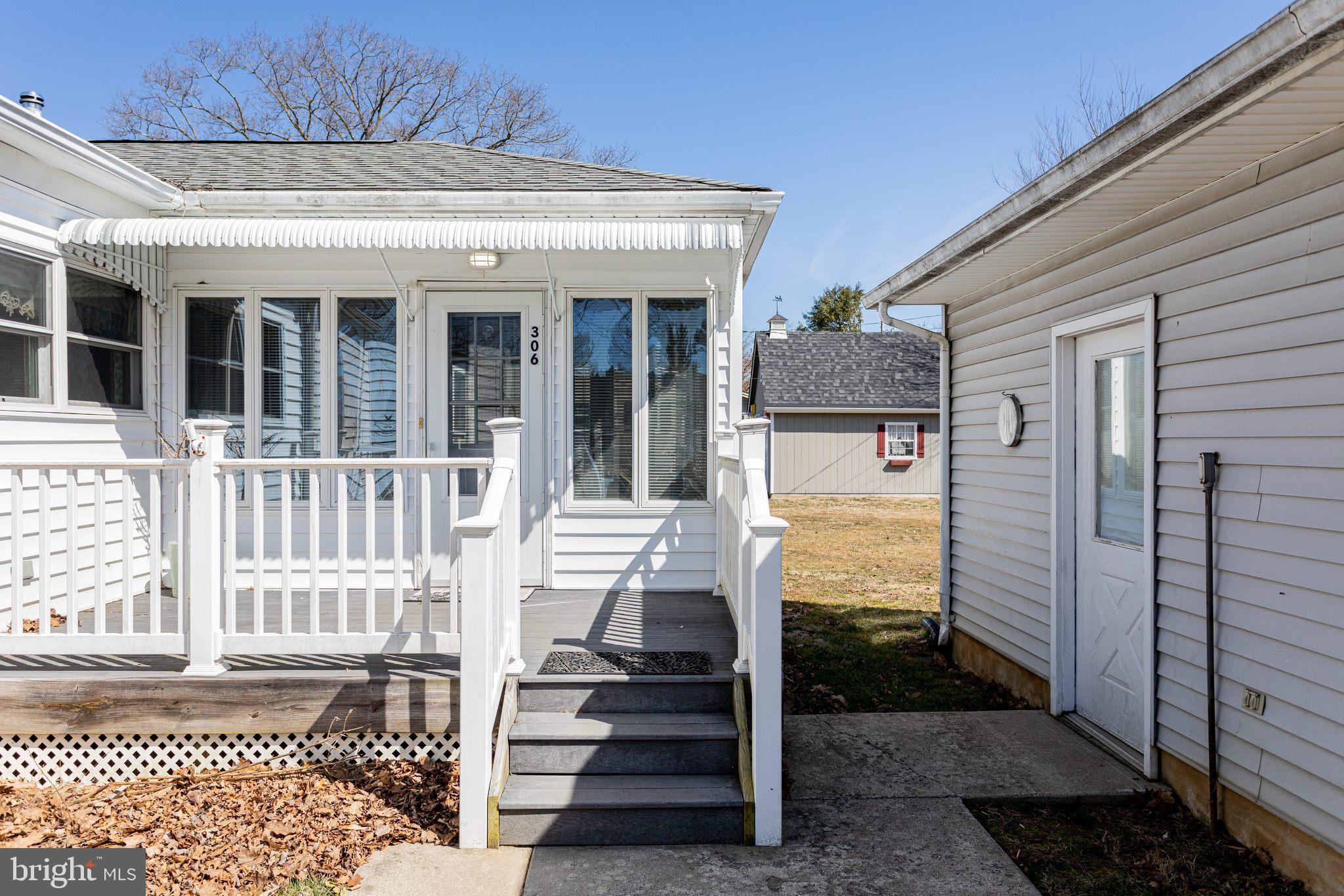 306 Hermitage Drive Elkton, MD 21921 - Photo 17 of 21 Staircase from deck with path to driveway & garage