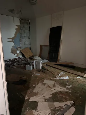 a room with water heater and wooden floor