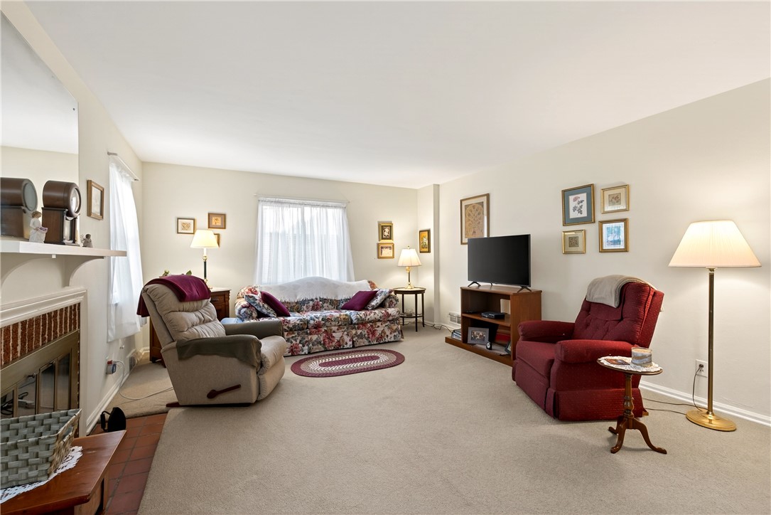 1237 Laurelwood Road Dayton, OH 45409 - Photo 7 of 56 This living room provides a warm and inviting atmosphere for relaxation and everyday living.