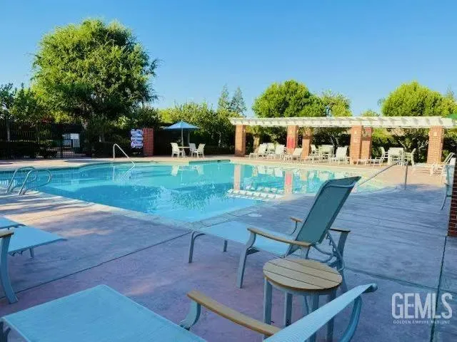 a view of a backyard with sitting area