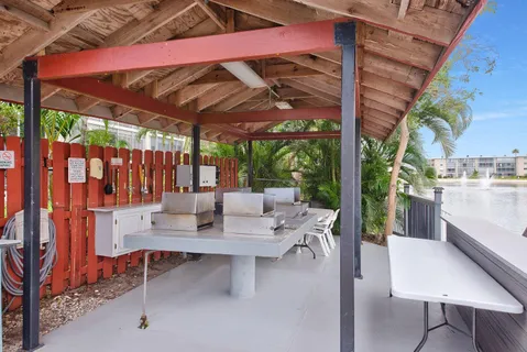 a view of an outdoor dining space with a patio