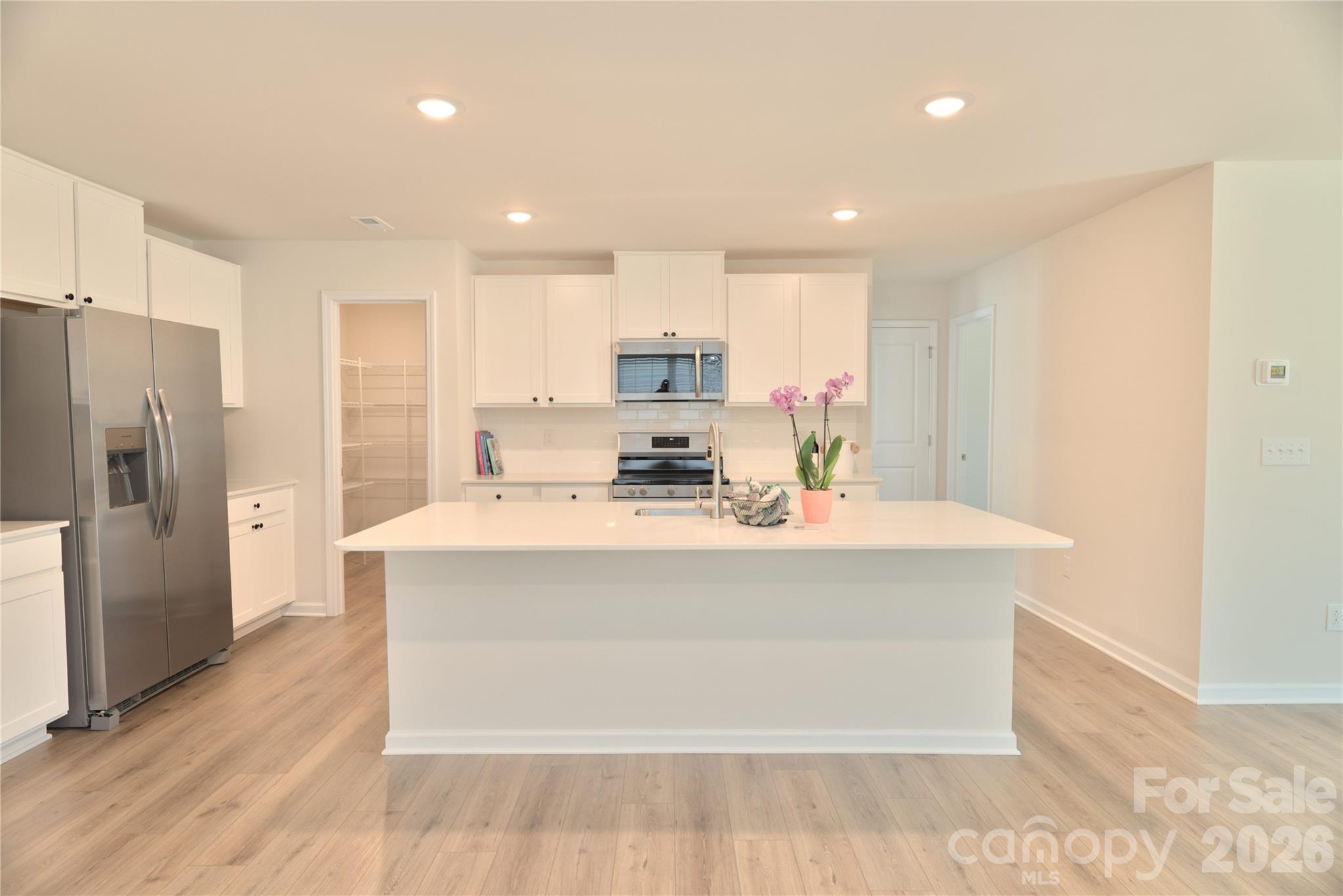 2154 Trollinger Drive Catawba, NC 28609 - Photo 4 of 33 a view of kitchen with stainless steel appliances granite countertop a stove a refrigerator a sink and a oven with wooden floor