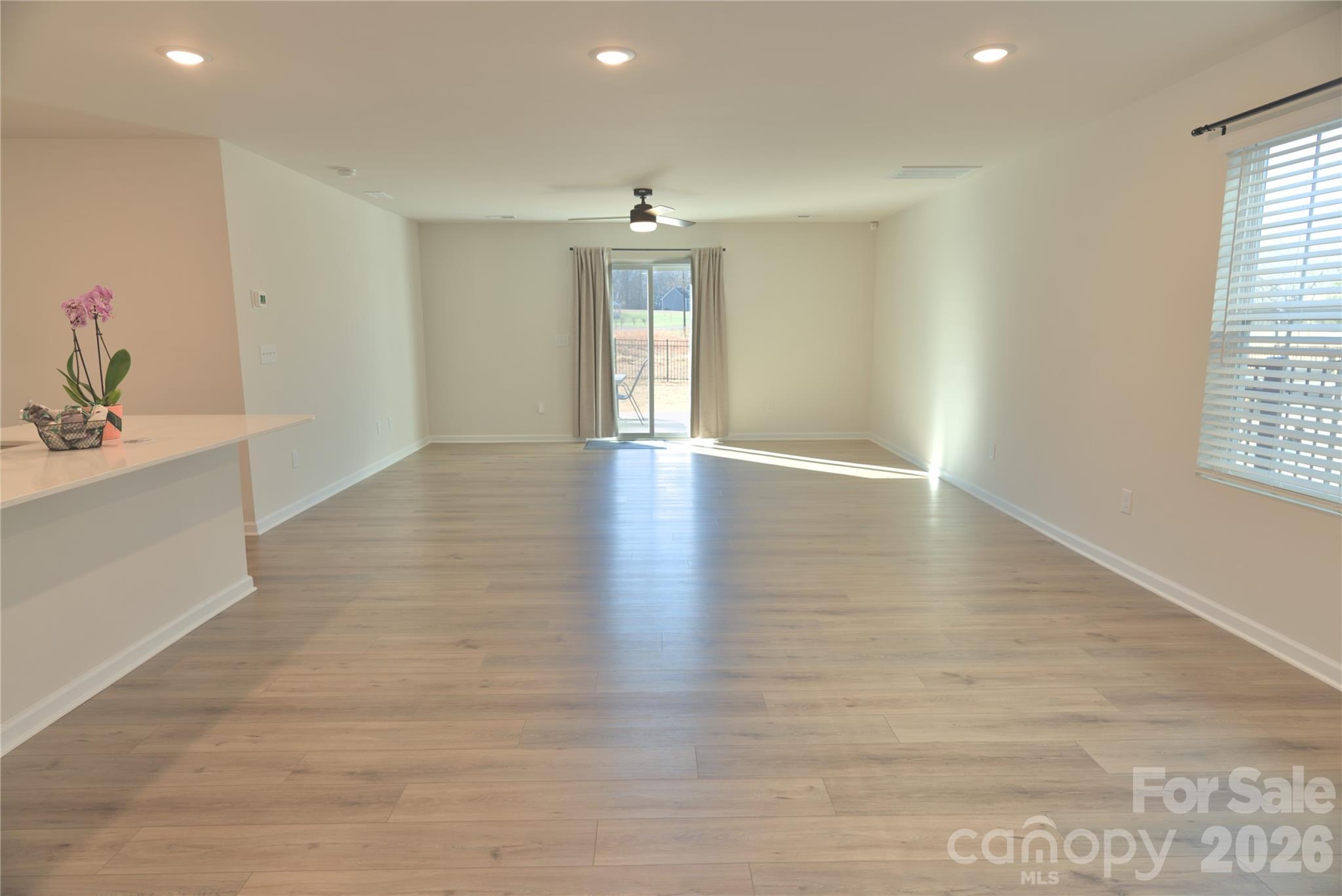 2154 Trollinger Drive Catawba, NC 28609 - Photo 6 of 33 an empty room with wooden floor and windows