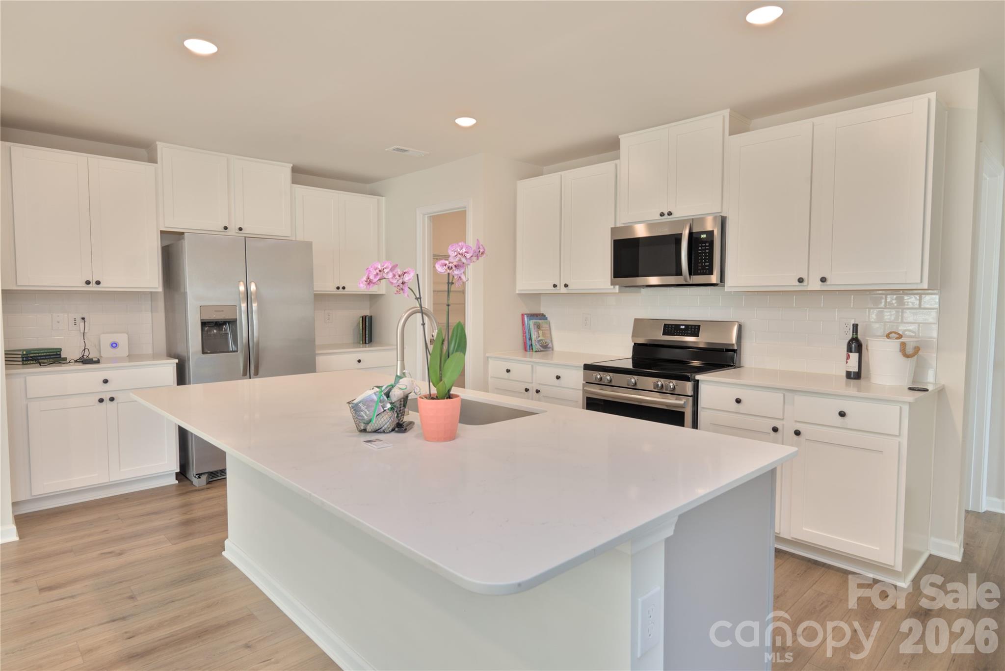 2154 Trollinger Drive Catawba, NC 28609 - Photo 10 of 33 a kitchen with stainless steel appliances a stove a sink a microwave a refrigerator and cabinets