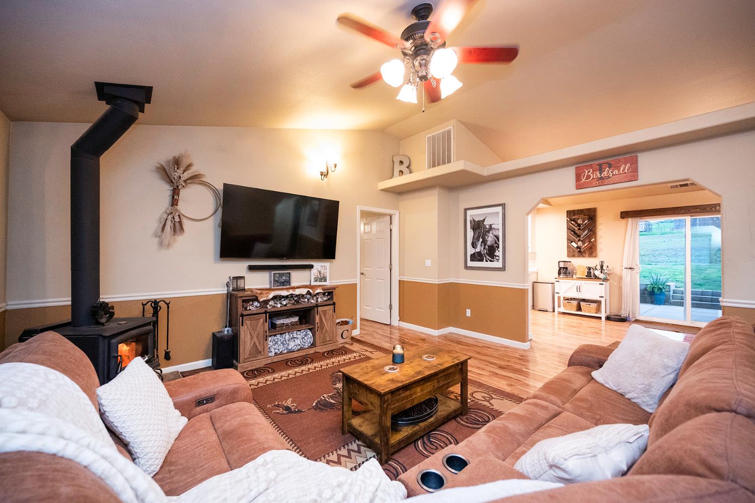 4568 Roadrunner Drive Ione, CA 95640 - Photo 15 of 56 a living room with furniture and a flat screen tv