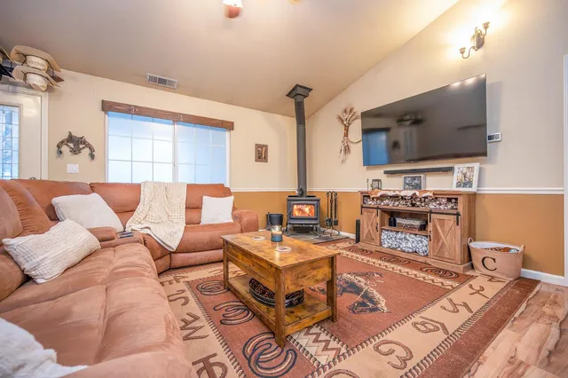 a kitchen with white cabinets stainless steel appliances and sink