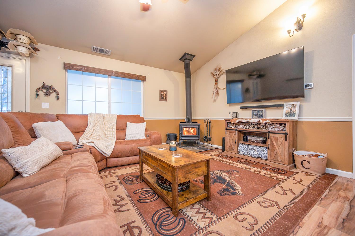 4568 Roadrunner Drive Ione, CA 95640 - Photo 20 of 56 a living room with furniture and a flat screen tv