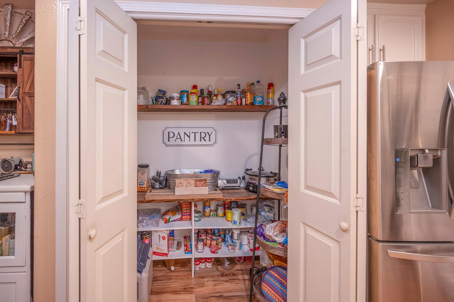4568 Roadrunner Drive Ione, CA 95640 - Photo 22 of 56 a room with furniture and a book shelf
