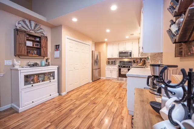 a view of a dining room with furniture and wooden floor