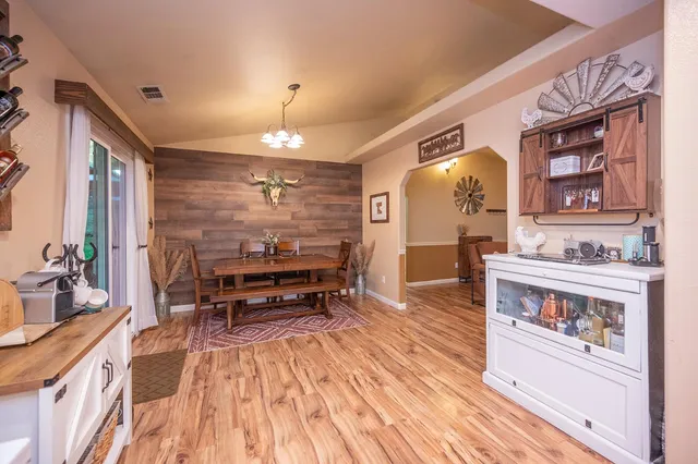 a bedroom with a bed dresser and a window