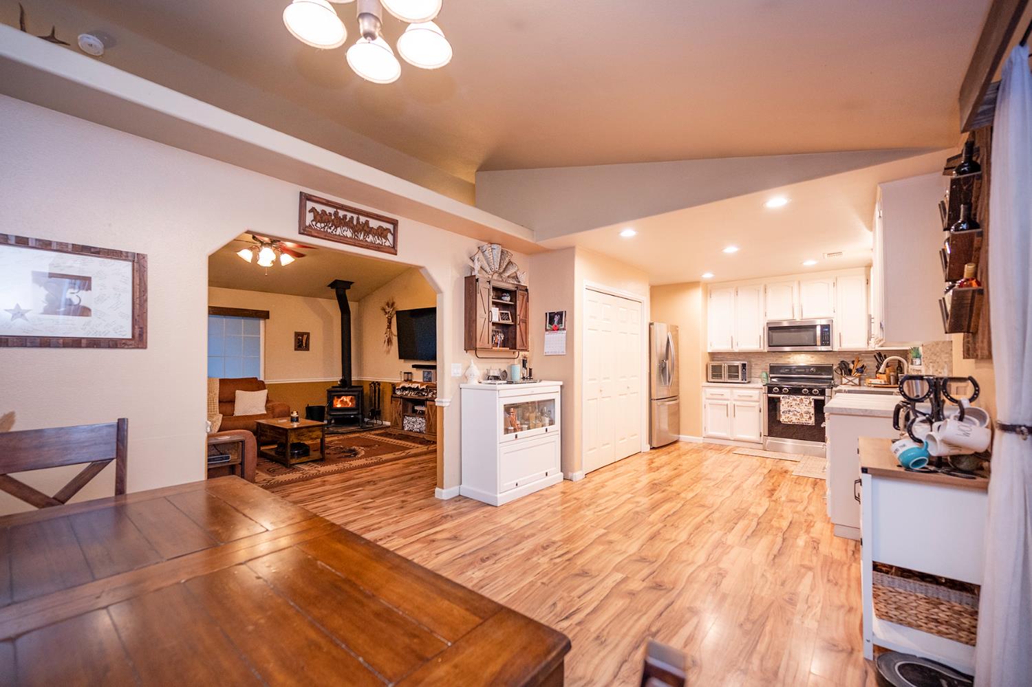 4568 Roadrunner Drive Ione, CA 95640 - Photo 32 of 56 a very nice looking open dining room with kitchen island