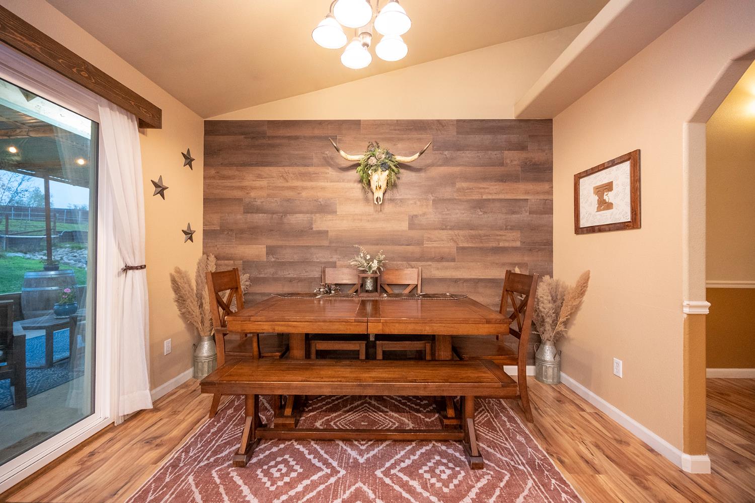 4568 Roadrunner Drive Ione, CA 95640 - Photo 33 of 56 a view of a dining room with furniture and wooden floor