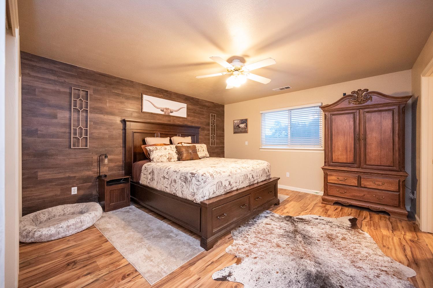 4568 Roadrunner Drive Ione, CA 95640 - Photo 34 of 56 a bedroom with a bed dresser and a window