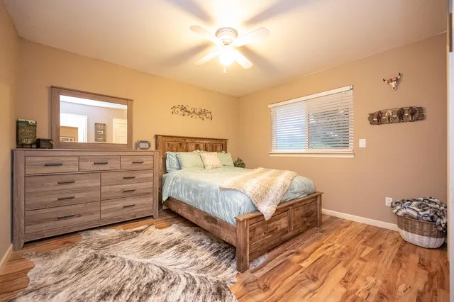 a bed room with furniture and a flat screen tv