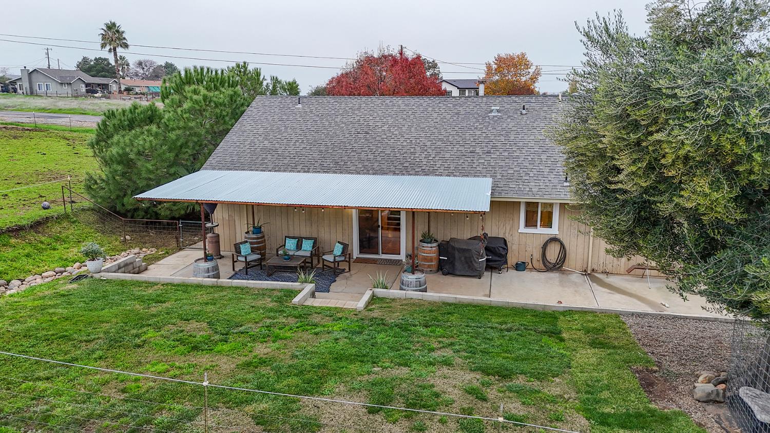 4568 Roadrunner Drive Ione, CA 95640 - Photo 46 of 56 a view of a house with backyard sitting area and garden