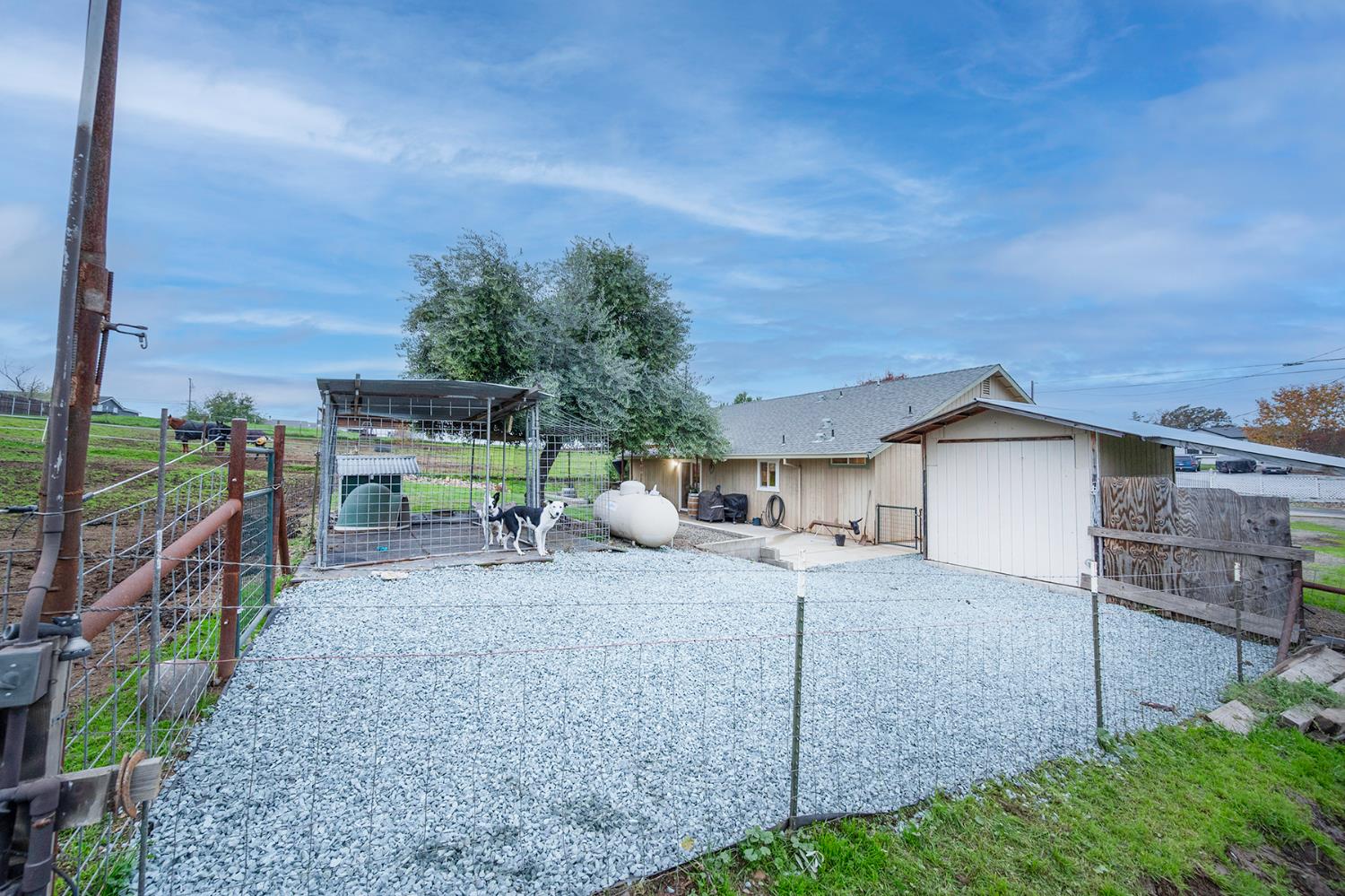 4568 Roadrunner Drive Ione, CA 95640 - Photo 55 of 56 a view of a chairs and table in the back yard of the house
