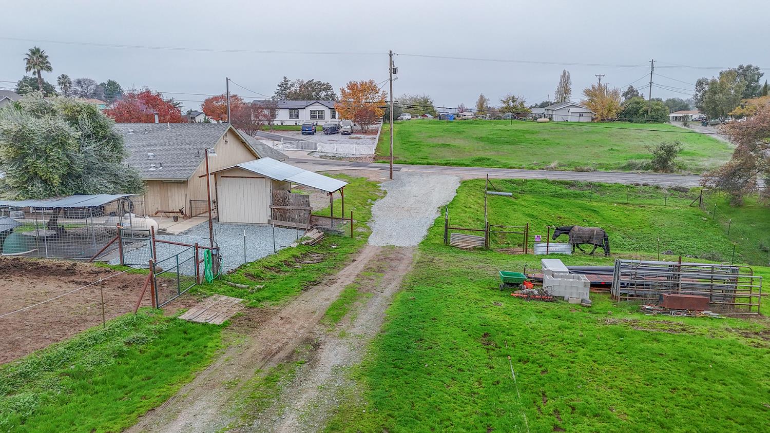 4568 Roadrunner Drive Ione, CA 95640 - Photo 7 of 56 a view of a house with a yard and potted plants