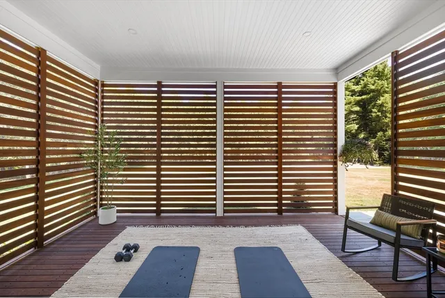 a view of a room with windows and wooden floor