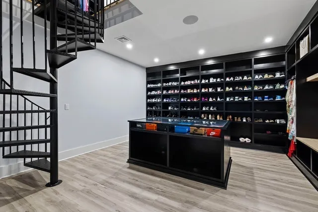 a room with wine cabinets and wooden floor