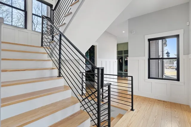 a view of entryway and hall with wooden floor