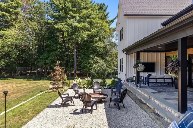 a view of a backyard with sitting area