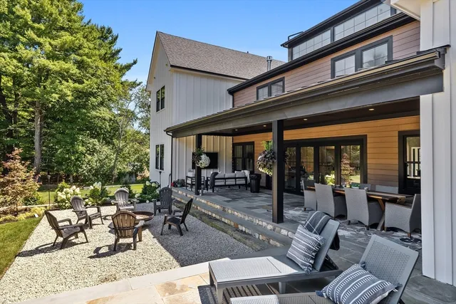 a view of a patio with table and chairs and potted plants