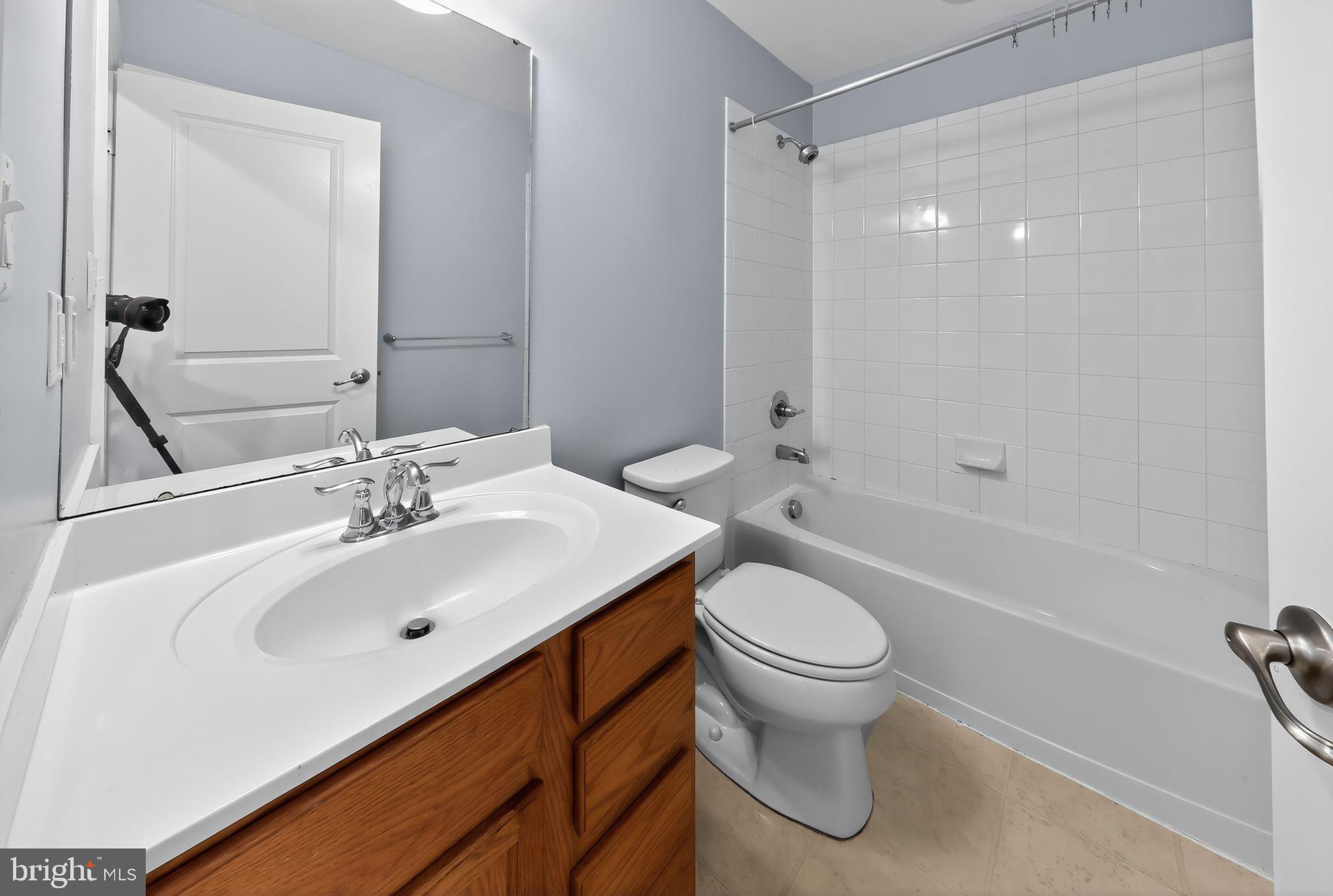 633 Barrie Road Middletown, DE 19709 - Photo 13 of 15 a bathroom with a sink toilet and shower