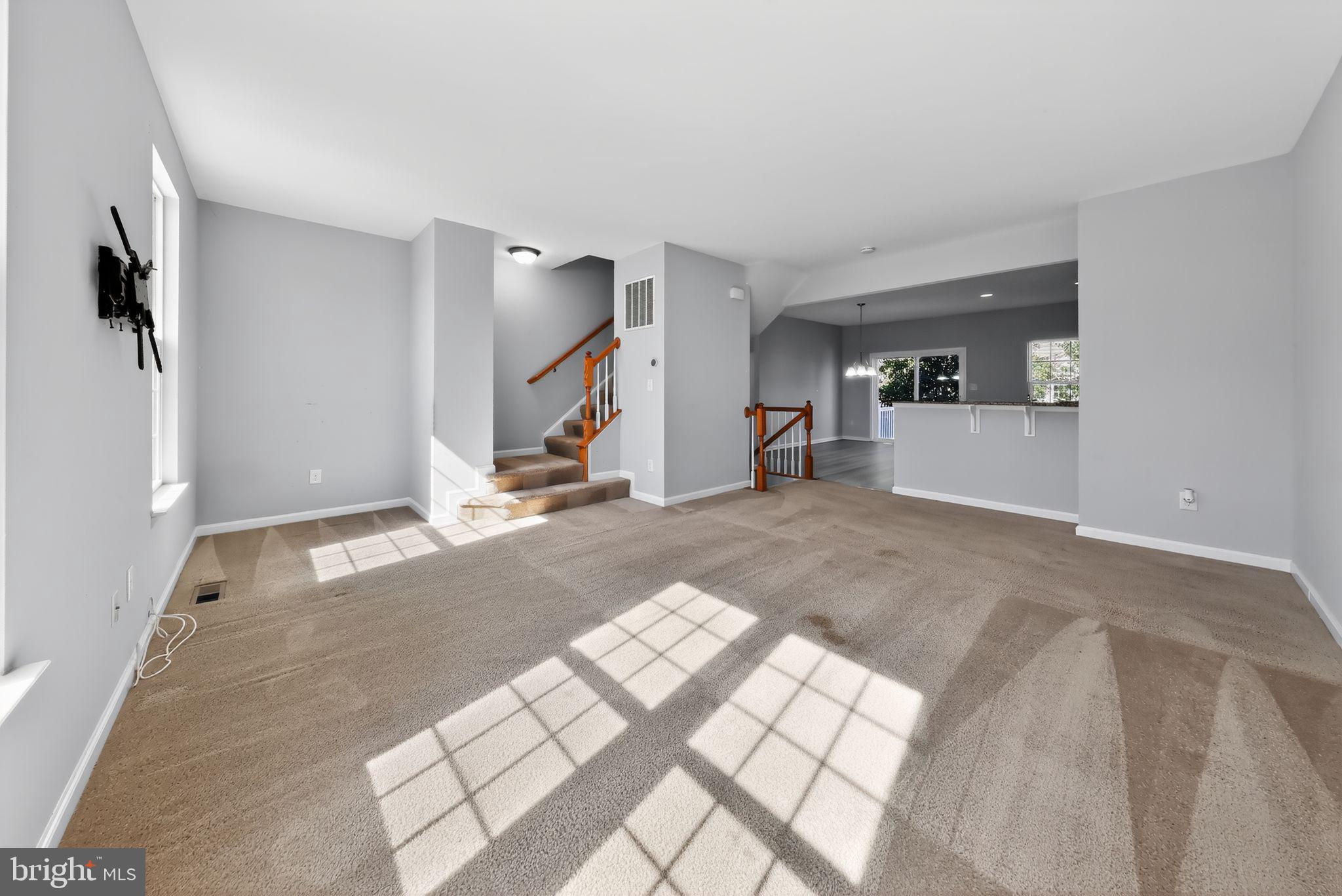 633 Barrie Road Middletown, DE 19709 - Photo 6 of 15 a view of a livingroom with wooden floor and furniture