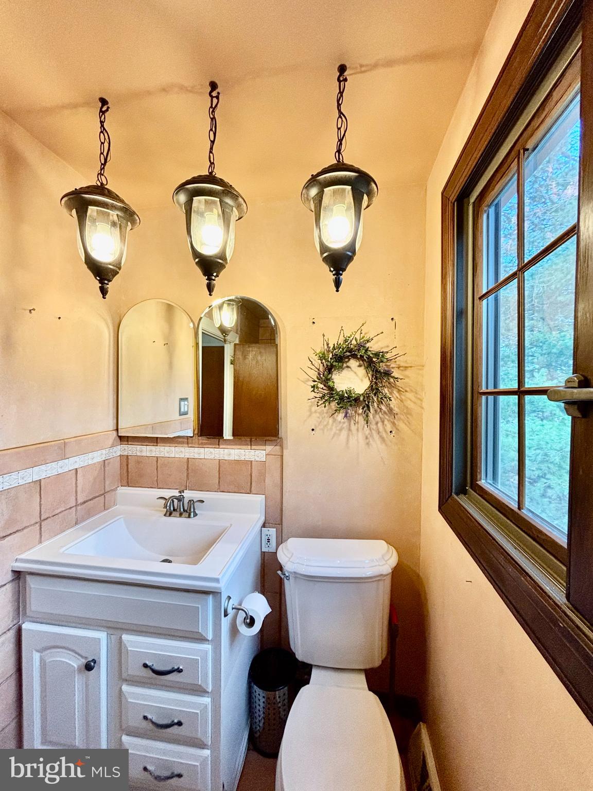 511 Boundary Road Pitman, NJ 08071 - Photo 15 of 30 a bathroom with a toilet a sink and mirror