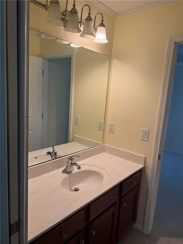 a bathroom with a sink and mirror