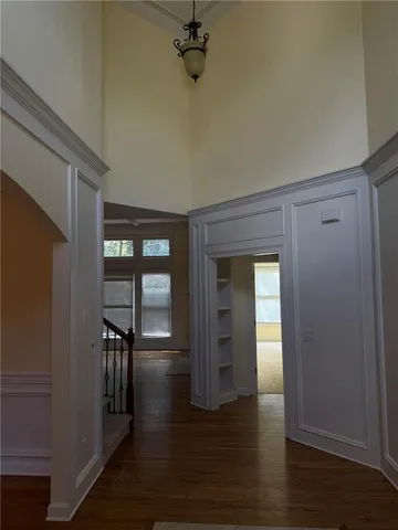 a kitchen with kitchen island granite countertop stainless steel appliances and wooden cabinets